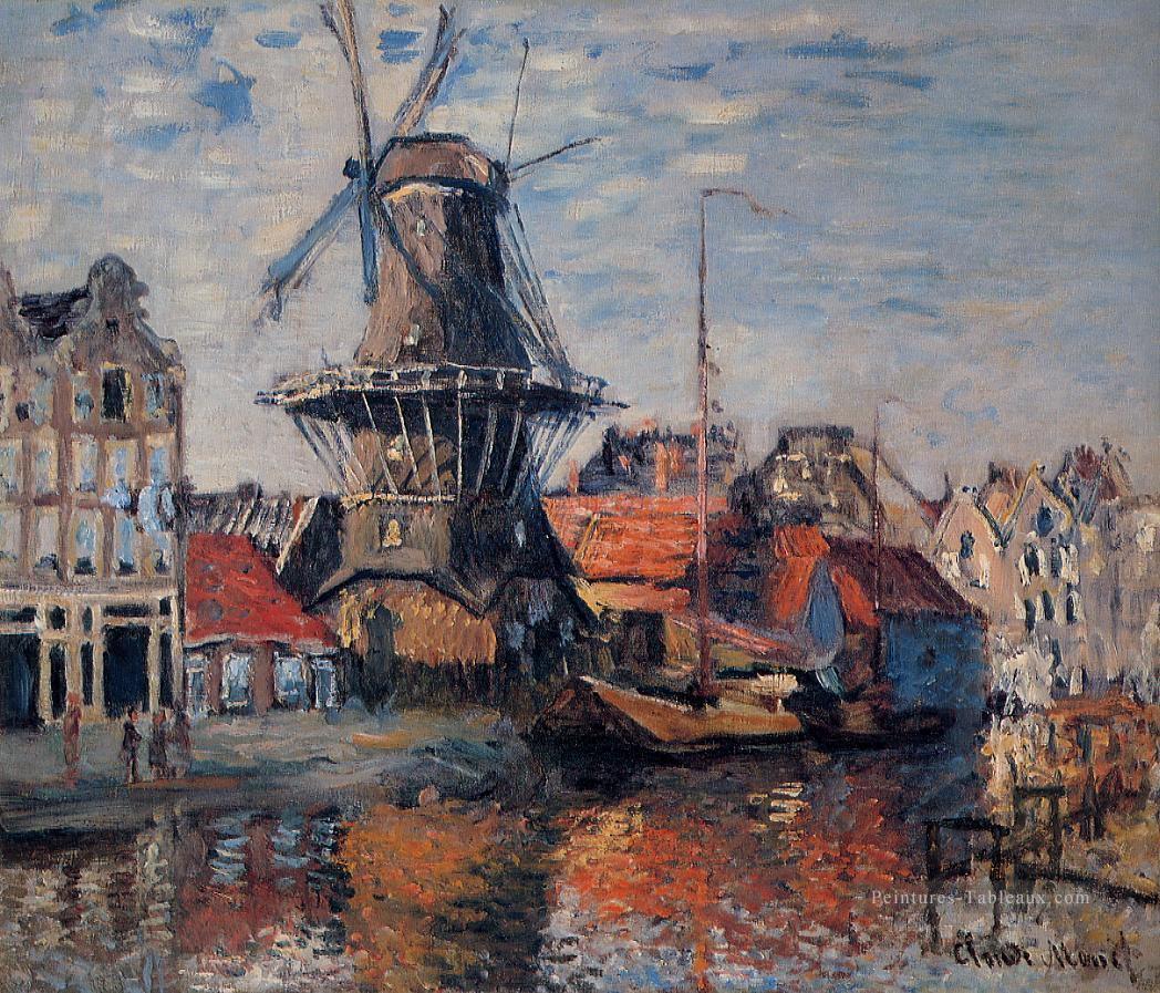 Le moulin à vent sur le canal d’Onbekende Amsterdam 1874 Claude Monet Peintures à l'huile